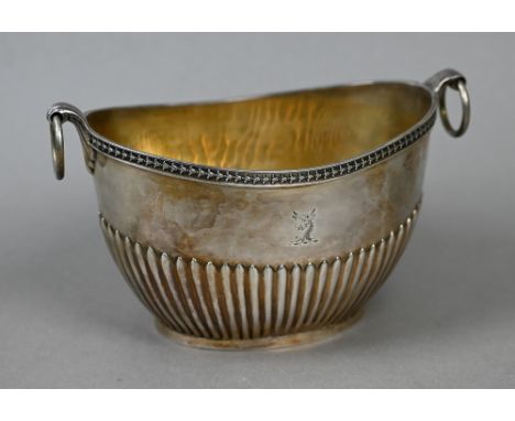 A Victorian silver half-reeded sugar basin of elliptical form with ring handles, Frederick Brasted, London 1875, 10.3oz 