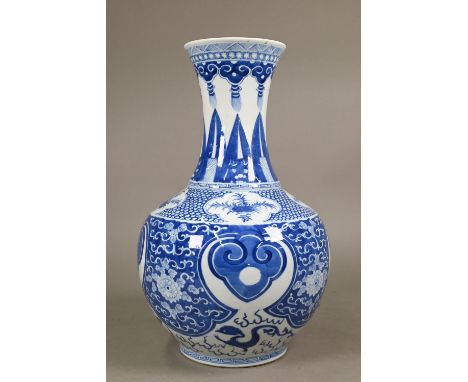 A late 19th century Chinese blue and white vase, the flared neck painted with diaper, ruyi-head and lappet banding interspers