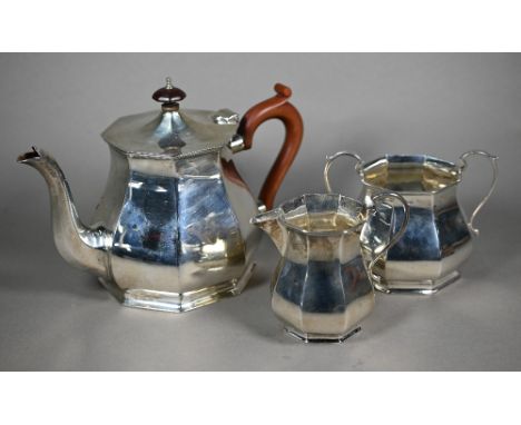 A silver three-piece tea service of octagonal form, the teapot with composite handle and finial,&nbsp;Alexander Clark &amp; C