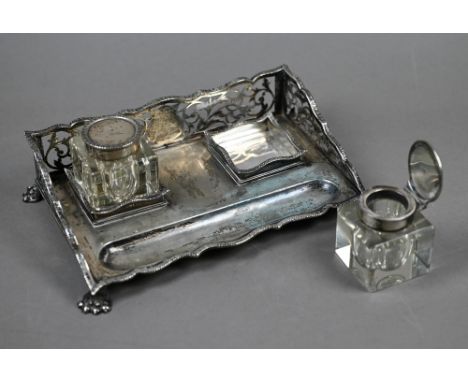 A Sheraton Revival silver inkstand with pierced three-quarter gallery, pen-trough and paw feet, fitted with two square cut gl