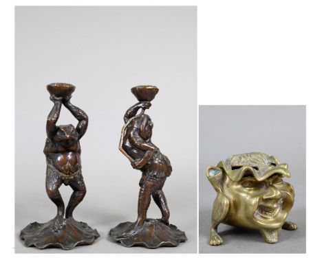 Two 20th century Japanese spelter candlesticks modelled as Kappa, the reptilian kami/yokai from Japanese folklore, each figur