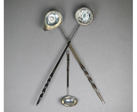 A George III silver punch ladle, set with a gilt 1758 shilling, London 1788, on twisted whalebone stem, to/w an unmarked ladl