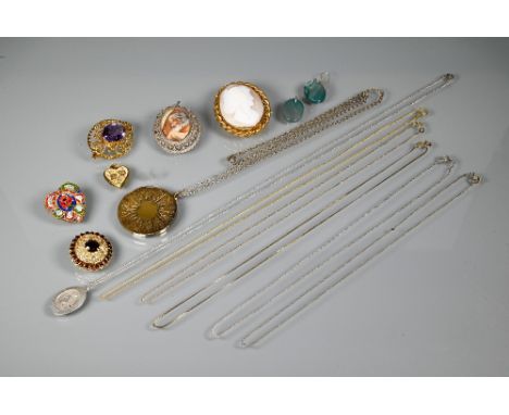 Three various brooches including a circular pierced yellow metal brooch set central garnet with garnet surround (pin detached