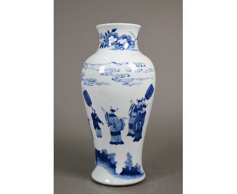 A Chinese blue and white baluster vase in the Qing dynasty manner, painted in underglaze blue with a rocky landscape, officia