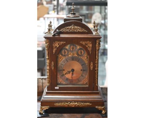 A monumental gilt metal mounted triple fusee table clock, the arched gilt dial with silvered Roman Numeral chapter ring and s