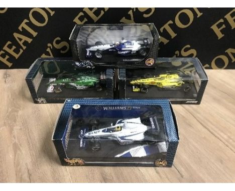 4 BOXED HOT WHEELS 1:18 SCALE F1 CARS INCLUDING MONTOYAS BMW, EDDIE IRVINES JAGUAR R1 ETC