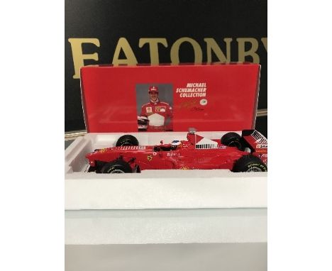 A BOXED PAULS MODEL ART 1:18 SCALE FERRARI F300 F1 CAR IN ORIGINAL BOX