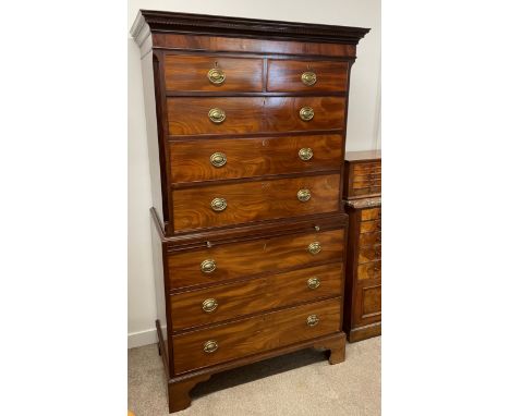 Georgian mahogany chest on chest with canted corners, a brushing slide, bracket feet &amp; brass plate handles. Ht 197cm W 11