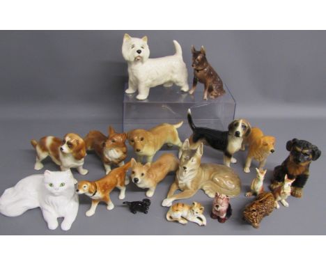 Collection of ceramic dogs and a ceramic cat