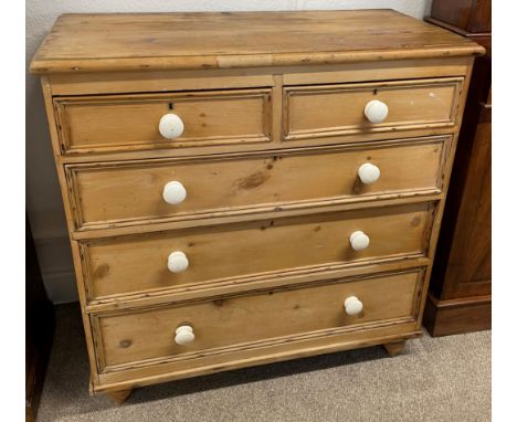 Victorian stripped pine chest of drawers with ceramic handles, back foot requires reattaching. W 102cm D 50cm Ht 105cm