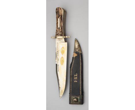 A BOWIE KNIFE, GEORGE WOSTENHOLM &amp; SON, WASHINGTON WORKS, SHEFFIELD, 20TH CENTURY with broad blade formed with a clipped-