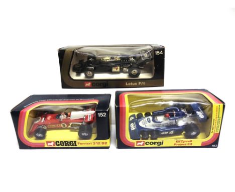THREE CORGI RACING CARS comprising a No.152, Ferrari 312 B2, red and white, racing number 5; No.154, Lotus Texaco F1, black a
