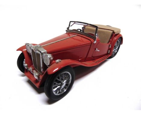 A 1/24 SCALE FRANKLIN MINT 1948 MG TC red, generally good condition (steering wheel rim with flaking paint; boot behind the s