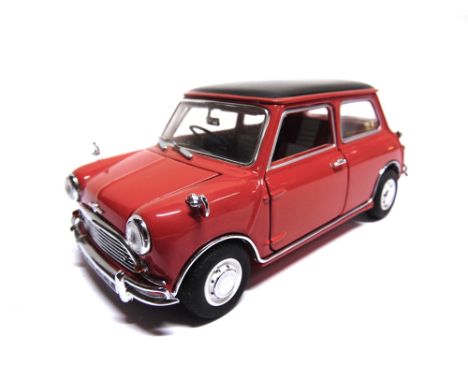 A 1/24 SCALE FRANKLIN MINT 1967 MORRIS MINI COOPER  red with a black roof, generally very good condition (one windscreen wipe