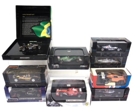 NINE 1/43 SCALE DIECAST MODEL FORMULA 1 &amp; INDYCAR RACING CARS each mint or near mint and boxed.