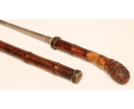 A SWORD STICK of bamboo construction with 20 1/2" square section steel blade, 34 1/4" long (Est. plus 21% premium inc. VAT)
