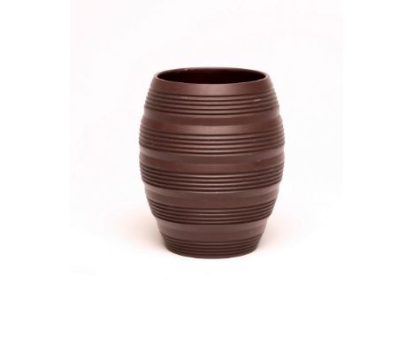 KEITH MURRAY FOR WEDGWOOD - A dark brown basalt barrel vase with five engine turned ribbed bands, impressed and red printed m
