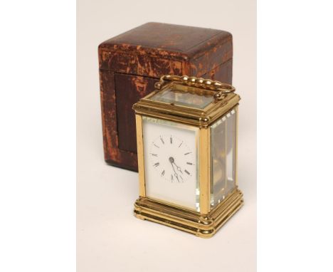 A GILDED BRASS CASED CARRIAGE CLOCK, c.1900, the twin barrel repeater movement regulated by a platform escapement and gong st