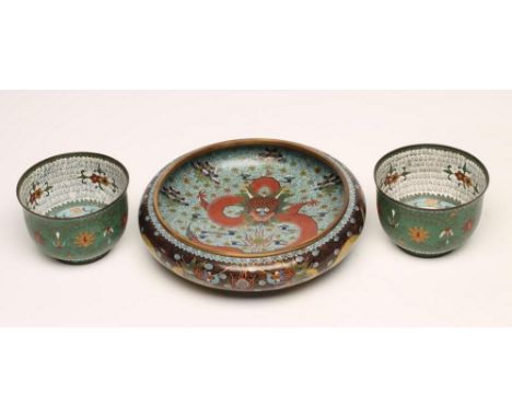 A PAIR OF CHINESE CLOISONNE ENAMEL BOWLS of plain rounded cylindrical form, the interiors centred by a green dragon on a whit