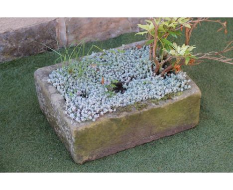 A SANDSTONE TROUGH of well cut oblong form, 22 3/4" x 17" x 8 3/4" (Est. plus 21% premium inc. VAT)
