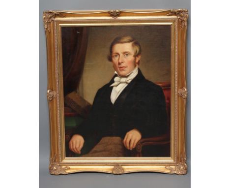 ENGLISH SCHOOL (Mid 19th Century), Portrait of a Young Man seated wearing a black Frock Coat, half length, oil on board, unsi