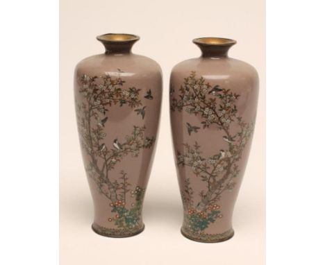 A PAIR OF JAPANESE CLOISONNE ENAMEL VASES of rounded cylindrical form, inlaid in sombre enamels with finches amidst blossomin