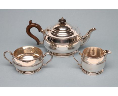 A THREE PIECE SILVER TEA SERVICE, maker E.S. Barnsley, Birmingham 1919, of single girdled squat globular form on a spreading 