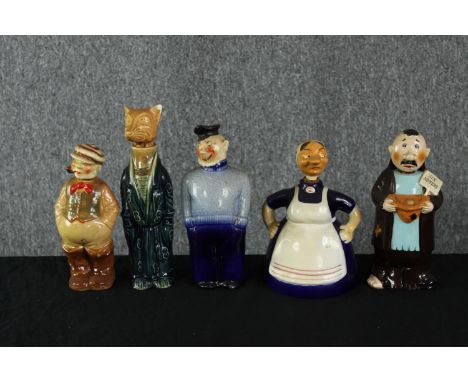 A collection of five vintage hand painted ceramic decanters modelled as various figures, including fisherman, beggar, washer 