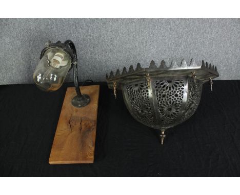 A aluminium outside lamp and a metal lamp shade. The lamps is probably 1950s. The shade is decorated with a light relief patt
