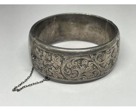 A HEAVY SILVER BANGLE 