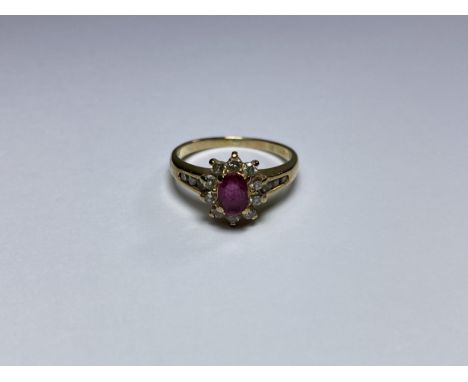 A VINTAGE 9CT YELLOW GOLD RUBY &amp; DIAMOND CLUSTER RING, WEIGHT 2.3G, WITH INSURANCE CERTIFICATE VALUE OF £978, DATED 1998 