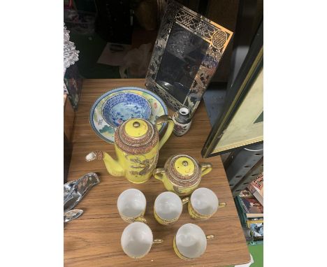 A PART JAPANESE COFFEE SET TO INCLUDE A COFFEE POT, SUGAR BOWL, CUPS IN YELLOW WITH DRAGON DESIGN, ORIENTAL PLATE, BOWL AND P