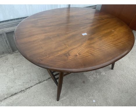 AN OVULAR ERCOL ELM AND BEECH COFFEE TABLE, 39X33", WITH MAGAZINE SHELF, BY ERCOLANI 