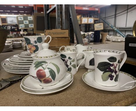 A QUANTITY OF CERAMICS WITH FRUIT DESIGN TO INCLUDE CUPS, SAUCERS, PLATES, JUGS AND A SUGAR BOWL 