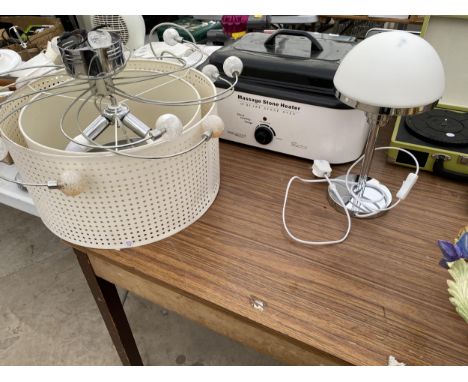 A LIGHT FITTING AND A MASSAGE STONE HEATER 