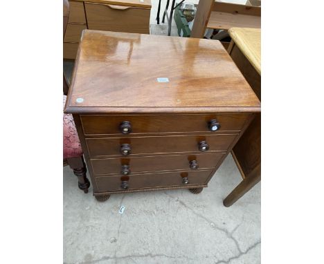 A 19TH CENTURY MAHOGANY CHEST COMMODE WITH TURNED HANDLES AND BALL FLUTED LEGS 