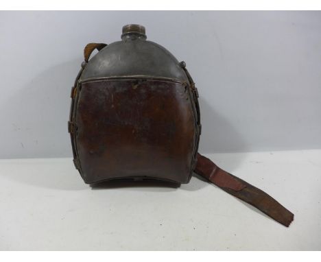 A LARGE WORLD WAR II BRITISH ARMY FAR EASTERN WATER BOTTLE WITH LEATHER STRAP 