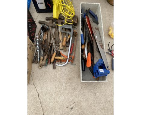 A LARGE ASSORTMENT OF HAND TOOLS TO INCLUDE HAMMERS, SAWS AND DRILL BITS ETC 