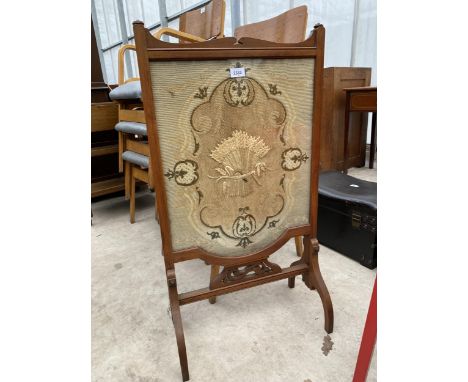 A VICTORIAN MAHOGANY FIRE SCREEN WITH WOOLWORK FRONT DEPICTING CORN SHEAVES 