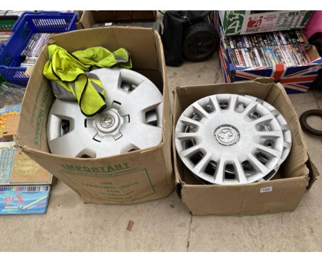 A COLLECTION OF VAUXHALL WHEEL RIMS AND TWO HI-VIZ JACKETS 