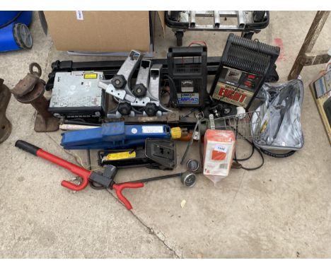 A LARGE ASSORTMENT OF AUTOMOBILE ITEMS TO INCLUDE A BLAUPUNKT CAR STEREO, BATTERY CHARGERS AND VARIOUS JACKS ETC 