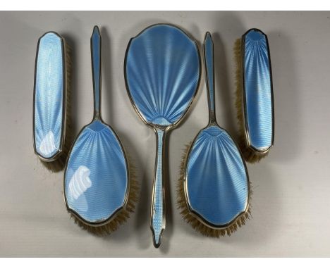 A FIVE PIECE HALLMARKED SILVER BACKED &amp; BLUE GUILLOCHE ENAMEL DRESSING SET COMPRISING TWO HAIR BRUSHES, TWO CLOTHES BRUSH
