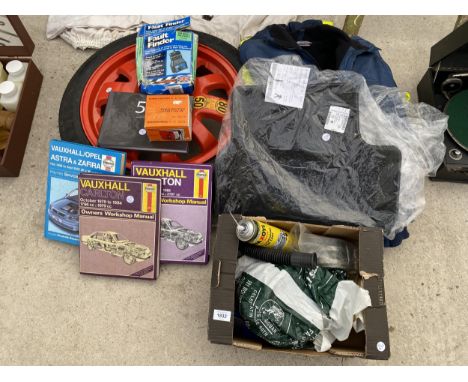 AN ASSORTMENT OF AUTOMOBILE ITEMS TO INCLUDE A SPARE WHEEL, CAR MATS AND HAYNES MANUALS ETC 