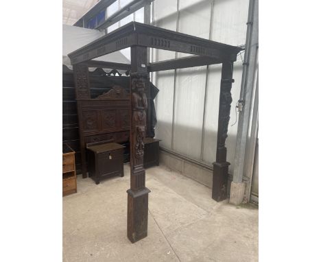 AN OAK JACOBEAN STYLE FOUR POSTER BED FRAME WITH CARVED PANELS, THE FRONT POLES FEATURING CARYATIDS. THIS LOT IS BELIEVED TO 