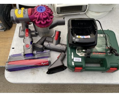 AN ASSORTMENT OF ITEMS TO INCLUDE A DYSON STICK VACUUM, A BOSCH DRILL AND A STHIL BATTERY CHARGER 