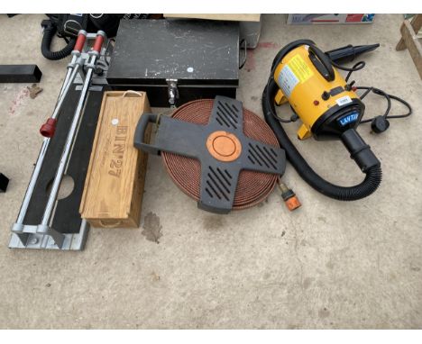 AN ASSORTMENT OF TOOLS TO INCLUDE A HOSE REEL, A PET DRYER AND A TILE CUTTER ETC 