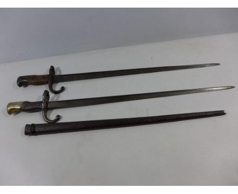 A FRENCH GRAS BAYONET AND SCABBARD DATED 1878, 52CM BLADE AND A FURTHER GRAS BAYONET (2) 