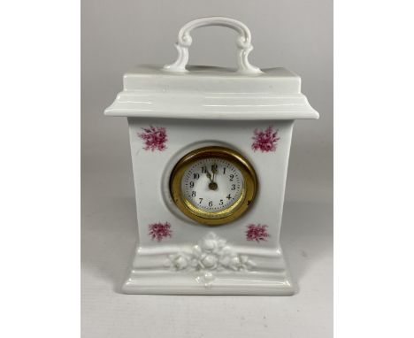 A CONTINENTAL CERAMIC MANTLE CLOCK 