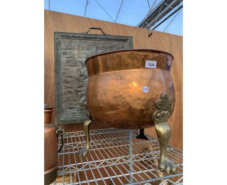A VINTYAGE COPPER COAL BUCKET ON BRASS LION PAW FEET AND A FURTHER BRASS FIRE SCREEN 