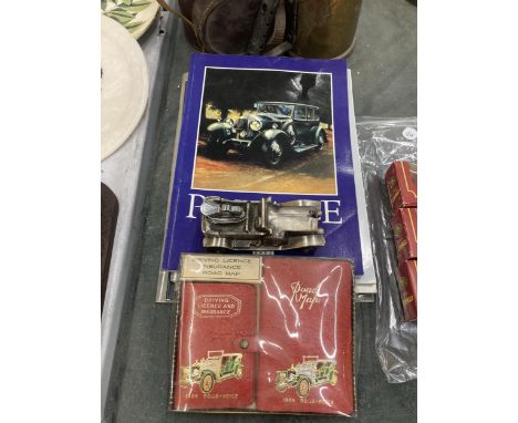 A ROLLS ROYCE MODEL TABLE LIGHTER, MAP, DRIVING LICENCE AND FIVE OFFICIAL ROLLS ROYCE BOOKS 